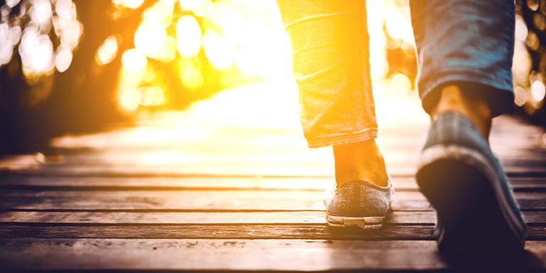 Social Impact Consulting image of someone walking on a deck