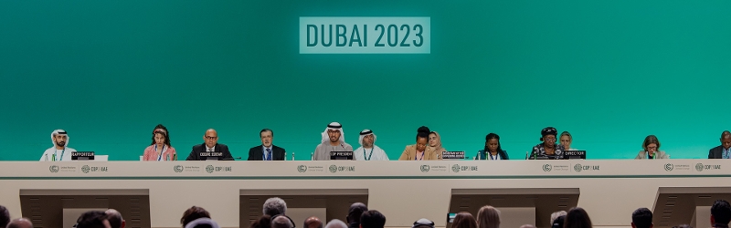 Annual sustainability event COP28 banner image of world leaders in the United Arab Emirates.