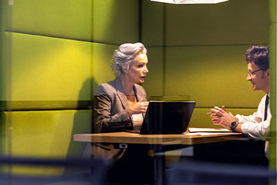 Business sucession planning image of two people in a meeting
